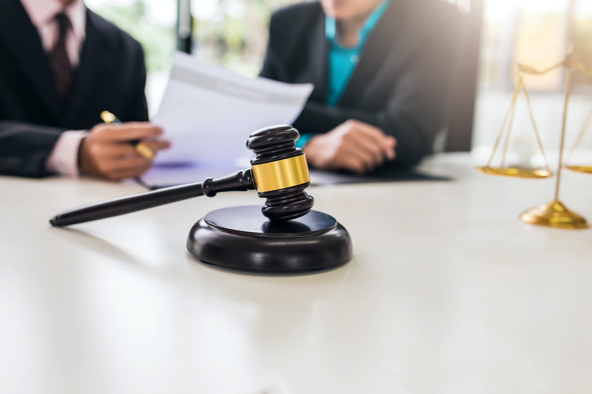 Team of lawyers man working together on legal matters in the office.
